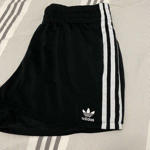 Women’s three stripe black adidas shorts